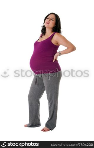 Beautiful pregnant Caucasian brunette woman holding her back with an uncomfortable expression. Pregnancy contraction back pains, isolated.
