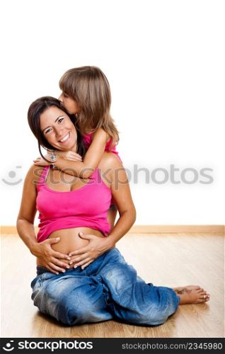 Beautiful pregnant mother with her daughter isolated on white