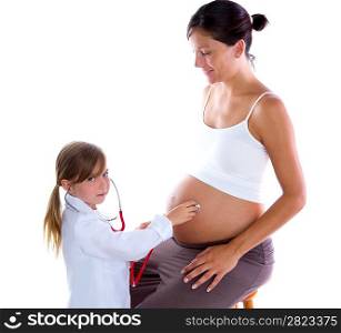 Beautiful pregnant woman and kid girl as doctor with stethoscope checking her belly