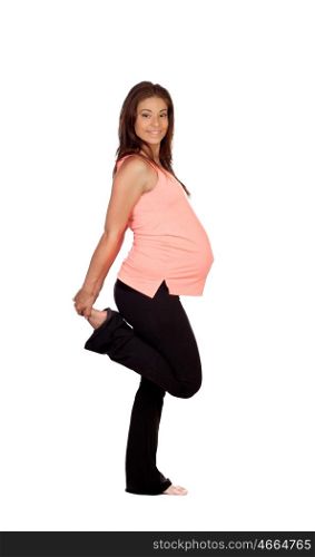 Beautiful pregnant woman doing stretching isolated on a white background