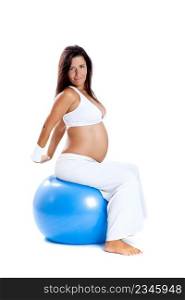 Beautiful pregnant woman making exercises on a fitness ball