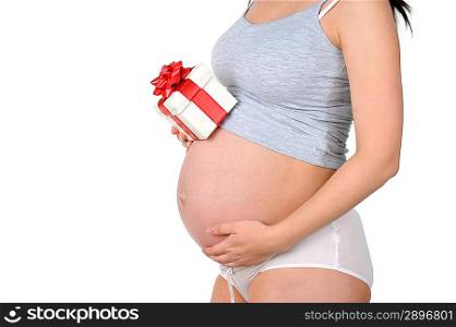 Beautiful pregnant woman with gift box