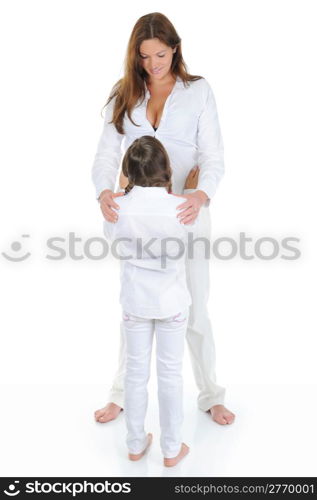 Beautiful pregnant woman with her daughter. Isolated on white background