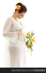 beautiful pregnant woman with yellow lily over white