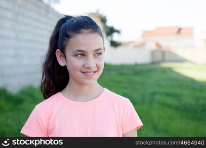 Beautiful preteen with blue eyes in the garden