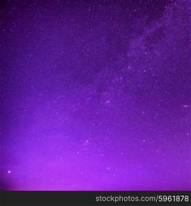 Beautiful purple night sky with many stars. Milkyway space background