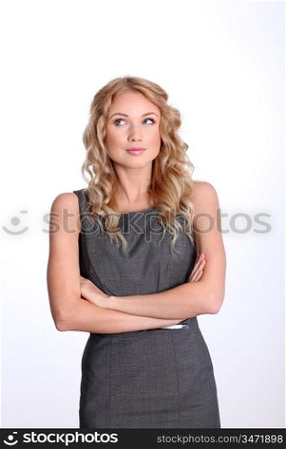 Beautiful puzzled businesswoman on white background