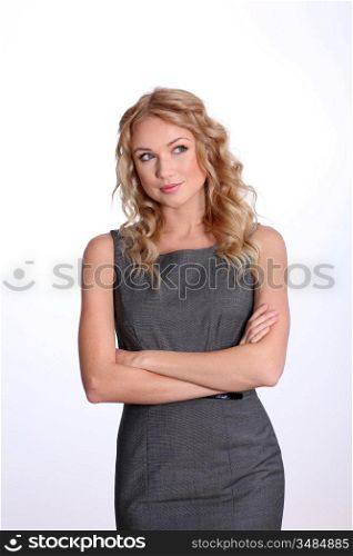 Beautiful puzzled businesswoman on white background
