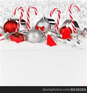 Beautiful red and silver christmas decor on snow