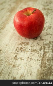 Beautiful red apple on a wooden background