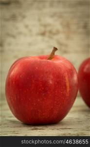 Beautiful red apples on a wooden background
