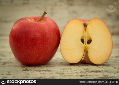 Beautiful red apples on a wooden background