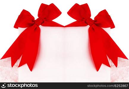 Beautiful red bows over blank greeting card, holiday concept