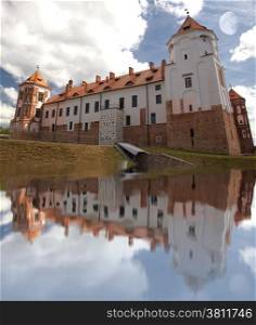 beautiful red brick castle stands in Europe.reflection in the water