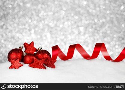 Beautiful red christmas decor on snow