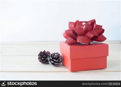 Beautiful red gift box on wooden table, Holiday gift, Valentine's Day concept