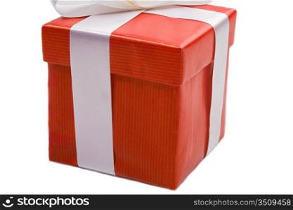 Beautiful red gift on a over white background