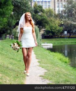 Beautiful red hair bride wearing wedding dress