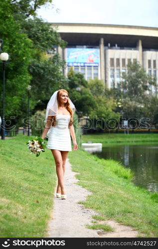 Beautiful red hair bride wearing wedding dress