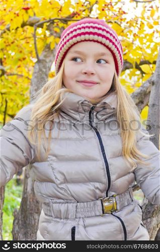 Beautiful Red Hat smiling girl in autumn