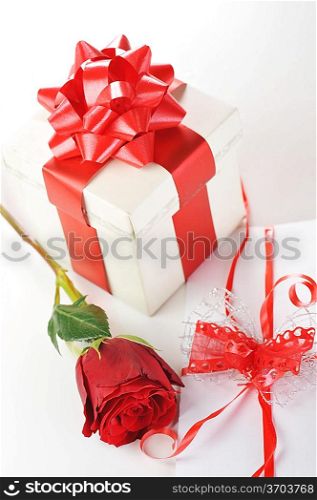beautiful red rose and letter with ribbon close up