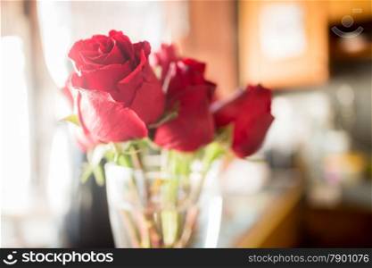 Beautiful red rose bouquet on vintage background, stock photo