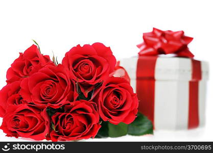 beautiful red roses and present with ribbon