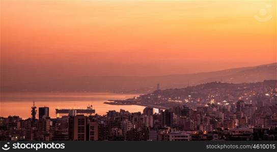 Beautiful red sunset on mountain city, evening cityscape, mediterranean sea, travel and tourism concept