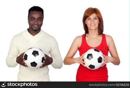 Beautiful redhead girl and attractive african men with a soccer ball isolated on a over white background