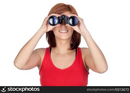 Beautiful redhead girl looking through binoculars isolated on a over white background