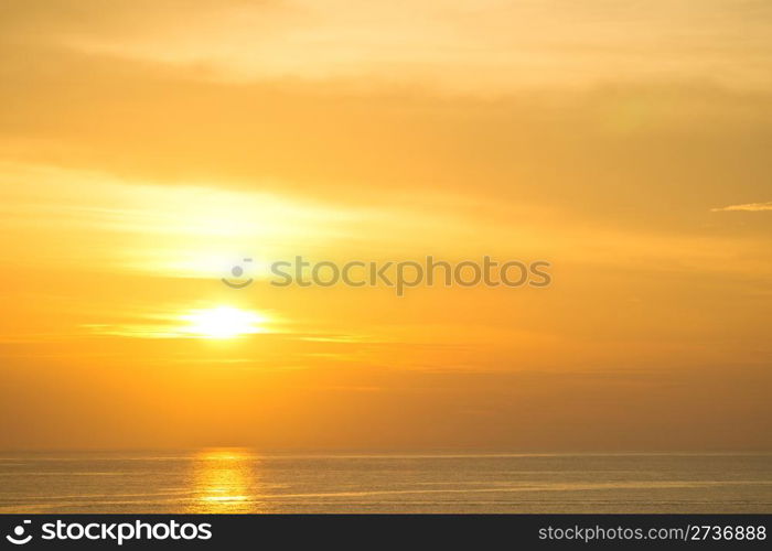 Beautiful reflection in water of orange sun