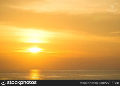 Beautiful reflection in water of orange sun