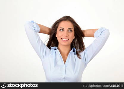 Beautiful relaxed woman with arms behing head