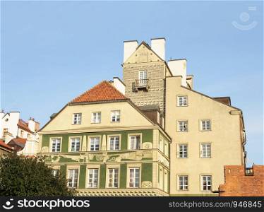 Beautiful residential buildings in Old City of Warsaw, Poland. Sunny summer evening.