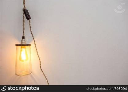 Beautiful retro luxury interior bulb lighting lamp decor glowing in a modern home background texture modern design. Beautiful retro luxury interior bulb lighting lamp decor glowing in a modern home background texture
