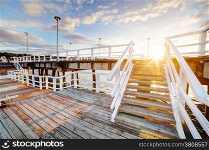 Beautiful retro pier at sunset over Baltic sea. Gdansk Brzezno, Poland