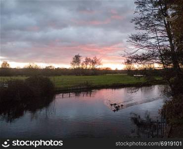 beautiful river autumn sun set scene outside country plain landscape; essex; england; uk