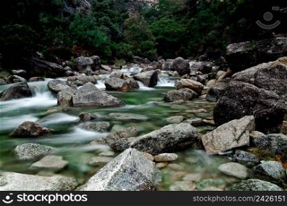 Beautiful river flowing by the stones