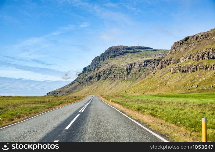 Beautiful road across Iceland countryside in summer.