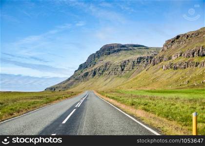 Beautiful road across Iceland countryside in summer.