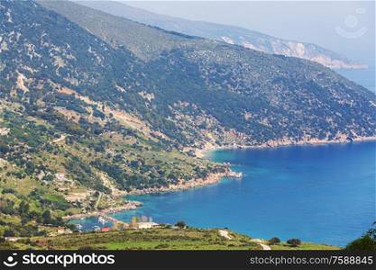 Beautiful rocky coastline in Greece. Sea, green hills, beautiful landscapes
