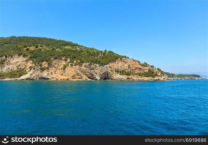 Beautiful rocky sea coast of Palmaria island near Portovenere (Gulf of Poets, Cinque Terre National Park, La Spezia, Liguria, Italy). People unrecognizable.