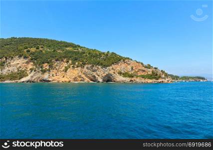 Beautiful rocky sea coast of Palmaria island near Portovenere (Gulf of Poets, Cinque Terre National Park, La Spezia, Liguria, Italy). People unrecognizable.
