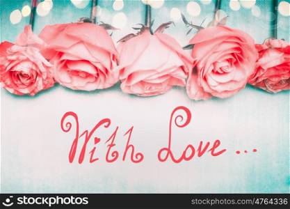 Beautiful romantic roses border on blue background with bokeh and lettering With Love in pastel color, greeting card