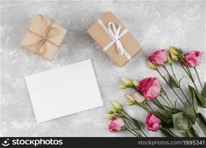 beautiful roses arrangement with wrapped gifts