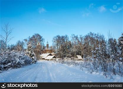 Beautiful rural landscape with a ruined church on a clear winter frosty day.