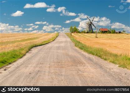 beautiful rural landscape with a windmill on a sunny day