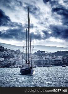 Beautiful sailboat on the sea in stormy weather, cruise on luxury water transport in the evening, travel and tourism concept