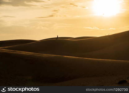 Beautiful sand dunes in red sand dune desert, Muine Vietnam, at sunrise