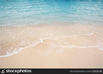 beautiful sandy beach with the blue waves rolling into the shore, Nassau in the Bahamas.